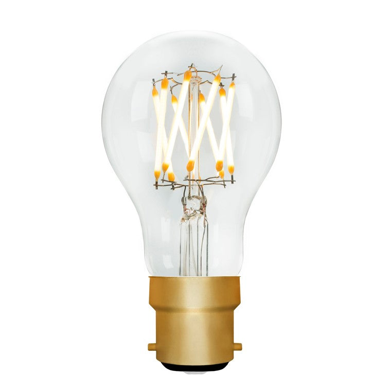 Clear light bulb with gold base on a white background