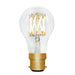 Clear light bulb with gold base on a white background